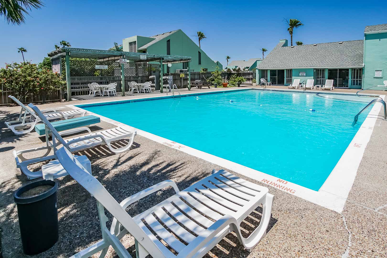 An outdoor swimming pool at VRI's Puente Vista Resort in Texas.